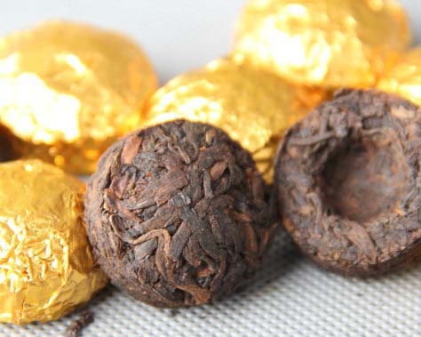 Mini tuo cha unwrapped from gold foil
